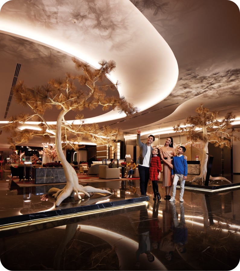 family standing at crockfords lobby at resorts world genting
